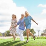 mother and daughters running in garden 2025 04 04 11 56 30 utc